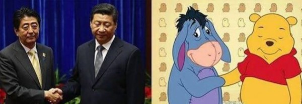 中國網友將習近平與日本首相安倍晉三握手的畫面,比作驢子屹耳與小熊維尼握手。(圖擷自推特)