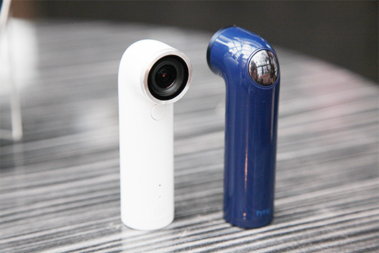 後方轉折處銀色部分即為拍攝按鍵，按一下為拍攝靜態影像，長按為拍攝動態影片 