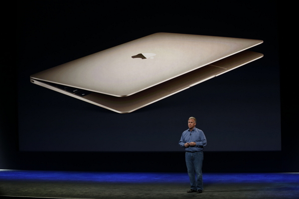 新版的 MacBook 將不再搭載會發亮的 logo,取而代之的是以金屬材質打造的蘋果標誌。(圖片來源/法新社)