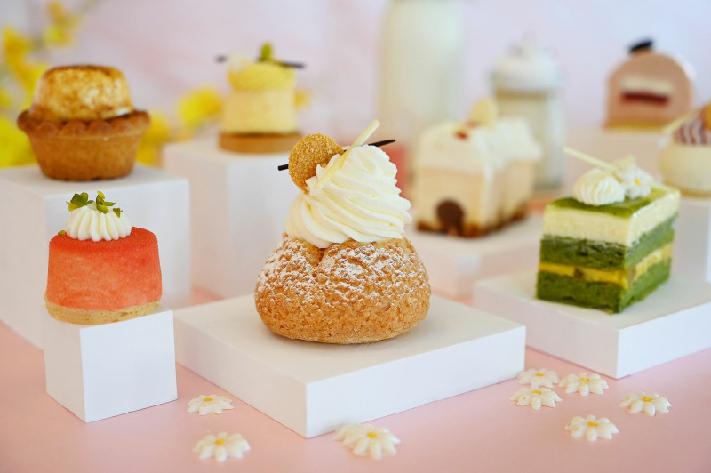 「北海道生乳泡芙」採用雙餡方式，將北海道十勝奶霜揉合香吉士果泥，酸甜相加甜而不膩。（墾丁凱撒提供）