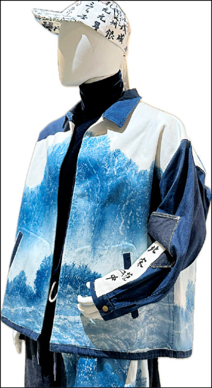 陳景林與周裕穎合作，將故宮名畫〈谿山行旅圖〉穿上身。