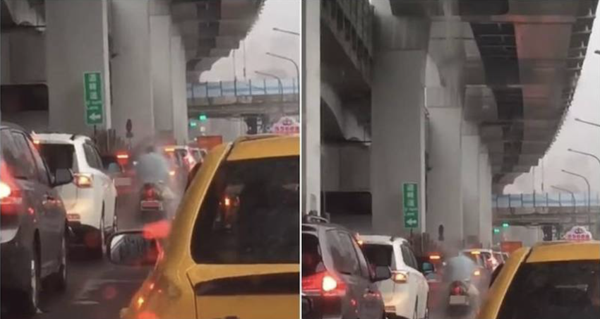 1 名騎士待在高架橋排水孔下沖水,被男網友拍下直呼「武學奇才」,瞬間引發大批網友熱議。(圖擷取自臉書社團「爆廢公社公開版」)