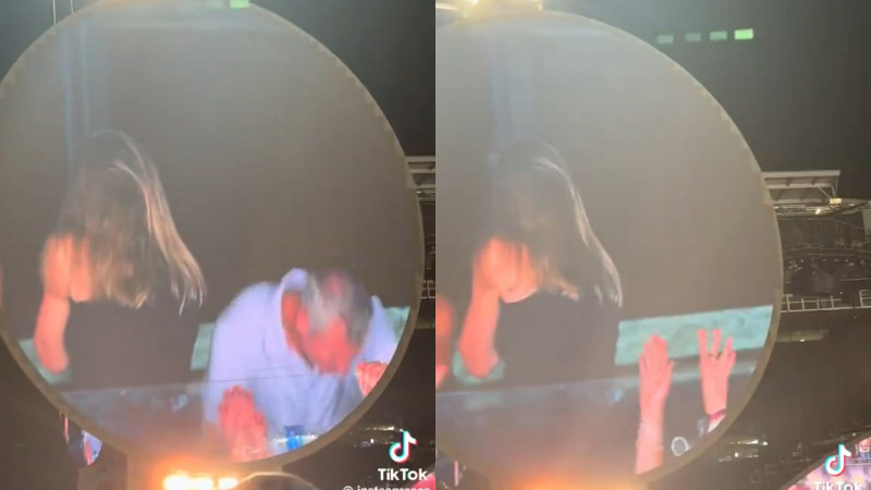 這對Coldplay粉絲發現上了鏡頭，男方立刻躲在地上，女方則是轉身。（翻攝自TikTok）