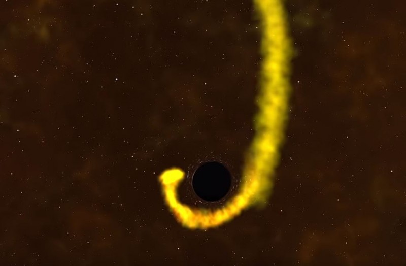 一顆恆星被黑洞吸引，受到潮汐干擾而被生吞活剝。（圖擷自NASA Goddard）