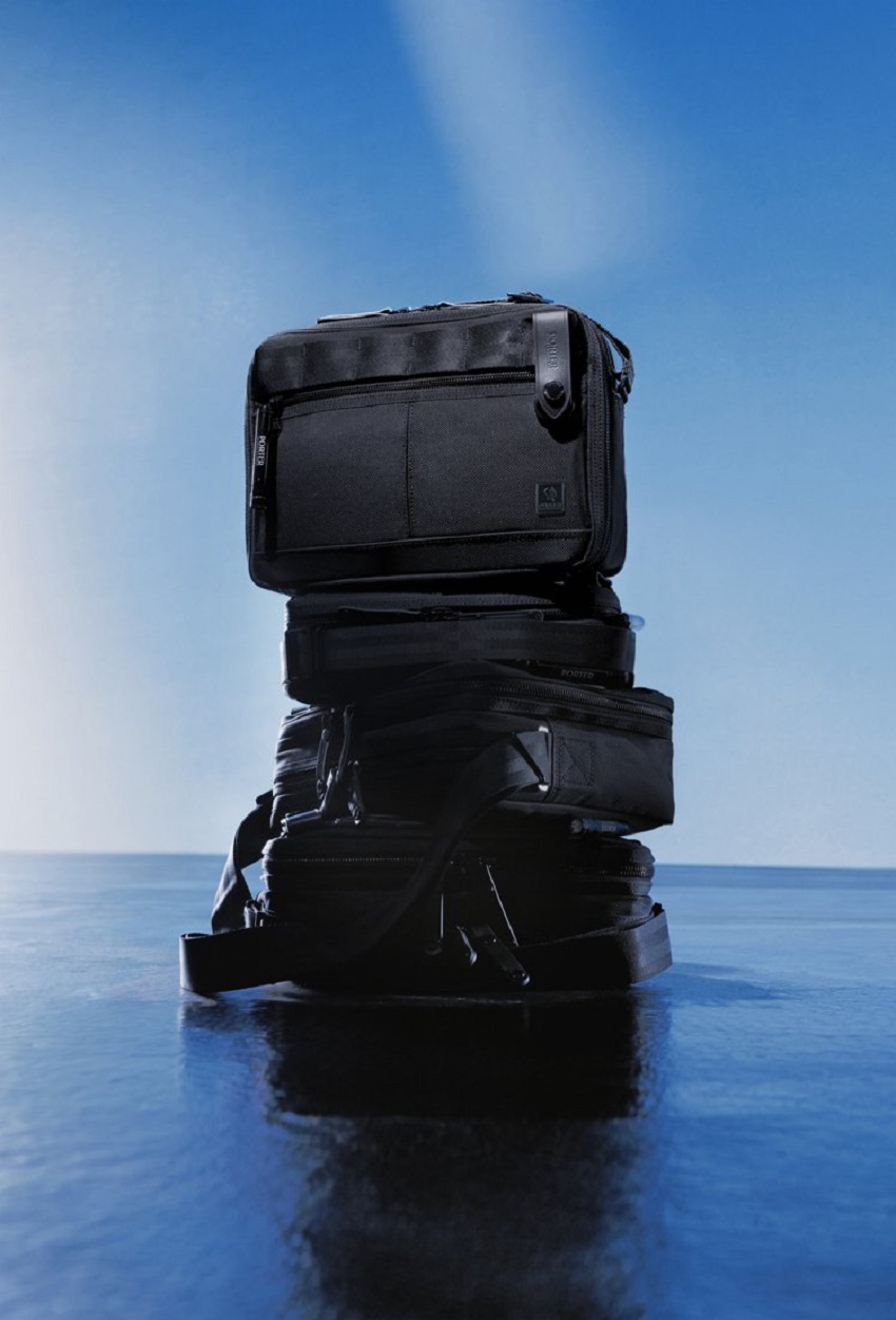 PORTER INTERNATIONAL NEW HEAT JET BLACK全系列包含24種包款，由裡到外皆為一貫的全黑色系，並搭配品牌經典配備，貫徹品牌「執著、自信、品味」的核心理念。