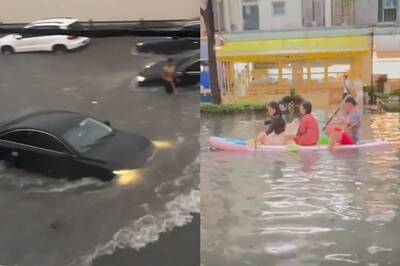 中國上海暴雨「馬路變黃河」 汽機車全泡垃圾水、民眾划小槳出門