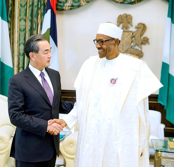 
Nigeria`s President Muhammadu Buhari greets China`s Foreign Minister Wang Yi, left, during his visit to the Presidential Villa in Abuja, Nigeria on Wednesday.
Photo: Reuters