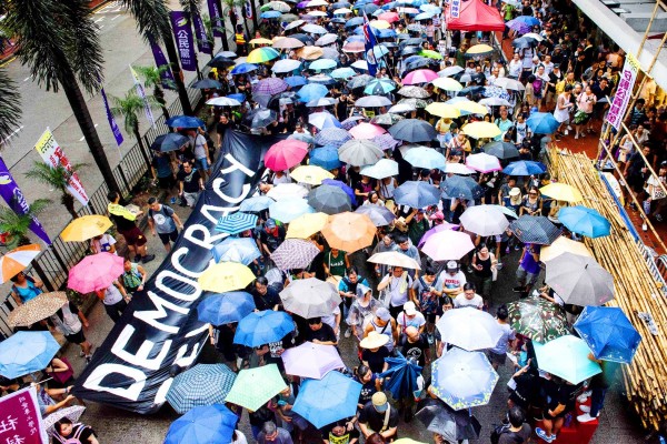 
Protesters carry a banner during a march in Hong Kong yesterday, the 20th anniversary of the territory’s handover from British to Chinese rule.
Photo: AFP