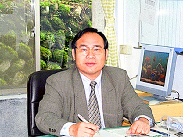 Yu-Shan Theological College and Seminary principal Pusin Tali sits at his desk in an undated photograph.
Photo courtesy of Yu-Shan Theological College and Seminary