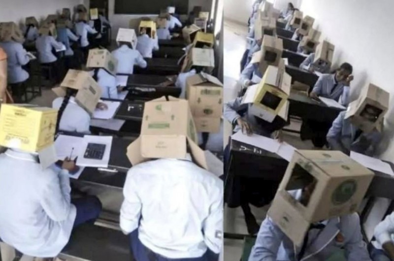 印度學校考試時為了防止作弊，學生們頭上竟都戴著紙箱。（圖擷自@Sain_Mushahid推特）