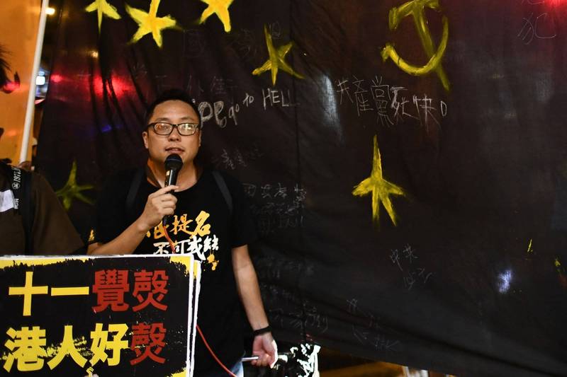 人民力量成員「快必」譚得志（見圖）被指控在今年街頭宣講時涉嫌發表煽動文字，前天遭到香港警方國家安全處拘捕。（法新社）