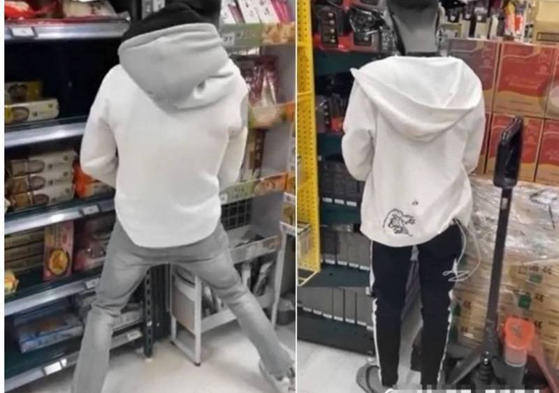 2名年輕男子在高雄家樂福鼎山店賣場內抽菸，並對著貨架尿尿，整段過程還誇張錄影PO網，引發網友肉搜撻伐。（圖擷取自「Dcard」）