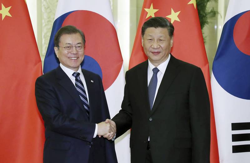 南韓總統文在寅2019年12月訪問中國，中國國家主席習近平在北京人民大會堂接見。（法新社檔案照）