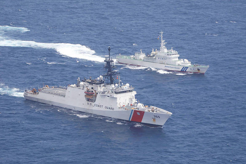 US Coast Guard cutter Munro, bottom, and Japan Coat Guard patrol vessel Large Aso sail in the East China Sea on Wednesday.
Photo: AP