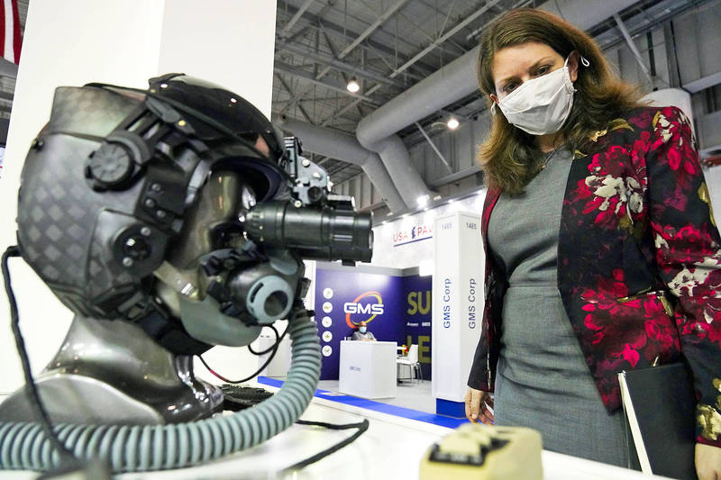 US Deputy Assistant Secretary of State for Regional Security Mira Resnick looks at night-vision goggles on display in the US section of the Dubai Air Show on Nov. 16 last year.
Photo: AP