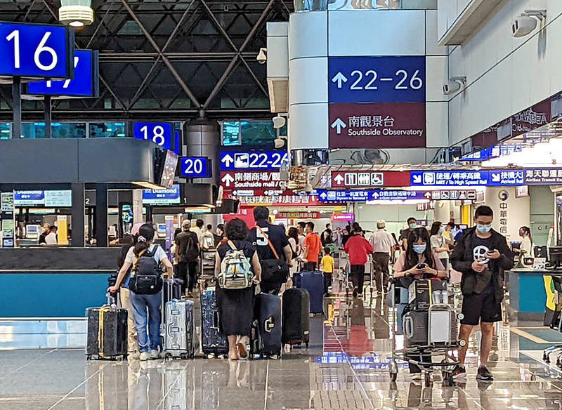 Travelers with masks walk through a terminal at Taiwan Taoyuan International Airport on Wednesday last week.Photo courtesy of Taiwan Taoyuan International Airport