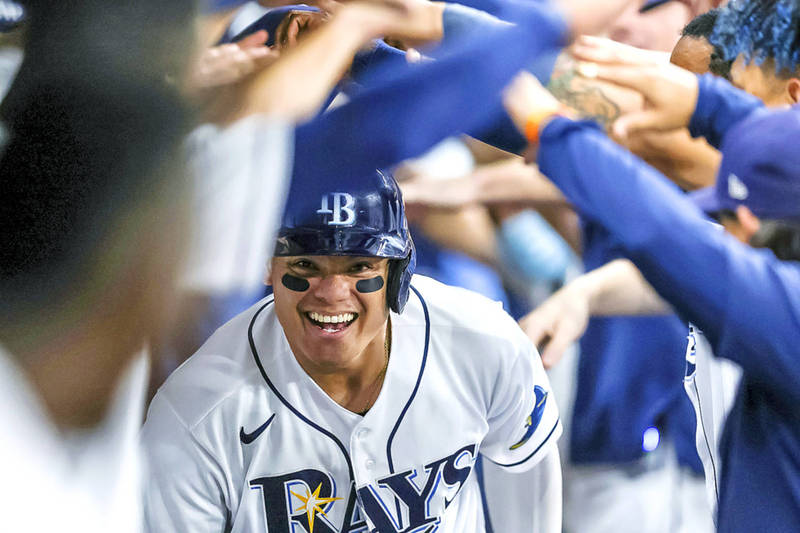 The Tampa Bay Rays’ Yu Chang of Taiwan celebrates in the dugout after hitting a home run against the Boston Red Sox in their MLB game in St Petersburg, Florida, on Tuesday.
Photo: AP