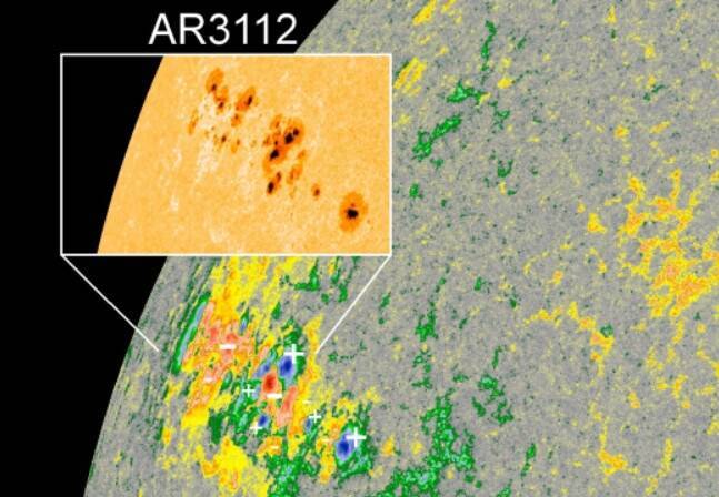 NASA太陽動力學天文台（SDO）所拍攝的AR3112黑子群。影像經偽色處理，並以＋－號代表磁場方向。（圖由北市天文館提供）