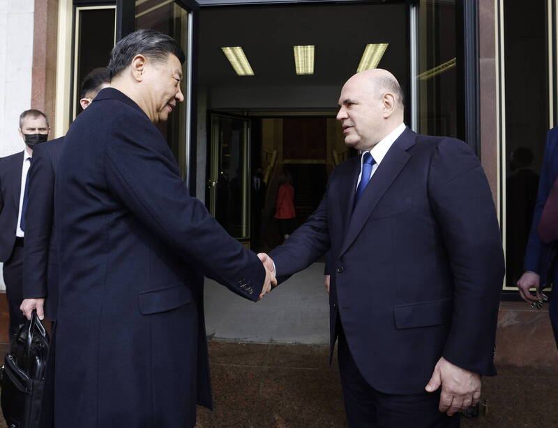 中国国家主席习近平（左）今日与俄罗斯总理米舒斯京（右）会面，并透露他邀普廷今年访中。（欧新社）(photo:LTN)