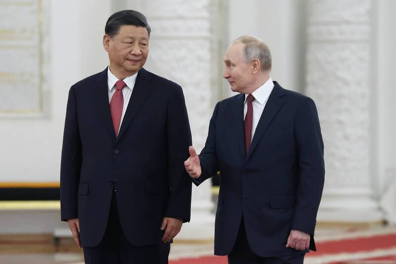 俄羅斯總統普廷（右）和中國國家主席習近平（左）3月21日在克里姆林宮會談。（法新社檔案照）