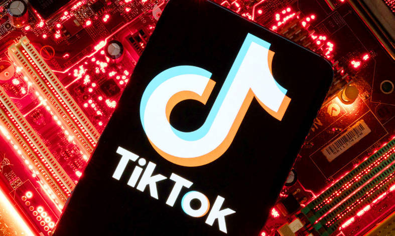 A smartphone displaying a TikTok logo is placed on a computer motherboard on Feb. 23. 
Photo: Reuters