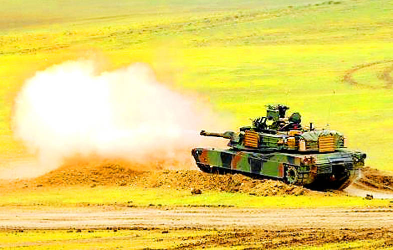 
An Abrams M1A2 tank fires a shell from a firing range emplacement in an undated photograph.
Photo: Reuters