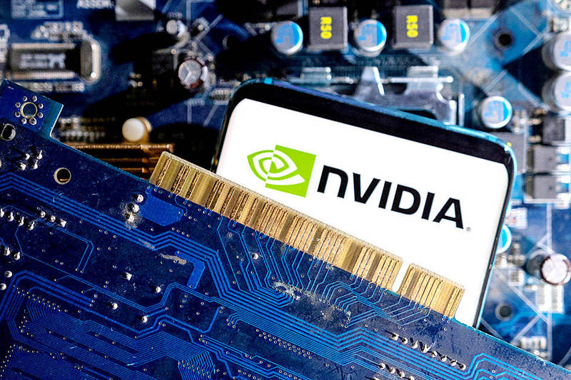 A smartphone displaying an Nvidia logo and a computer motherboard are pictured on March 6 last year.
Photo: Reuters A smartphone displaying an Nvidia logo and a computer motherboard are pictured on March 6 last year.
Photo: Reuters