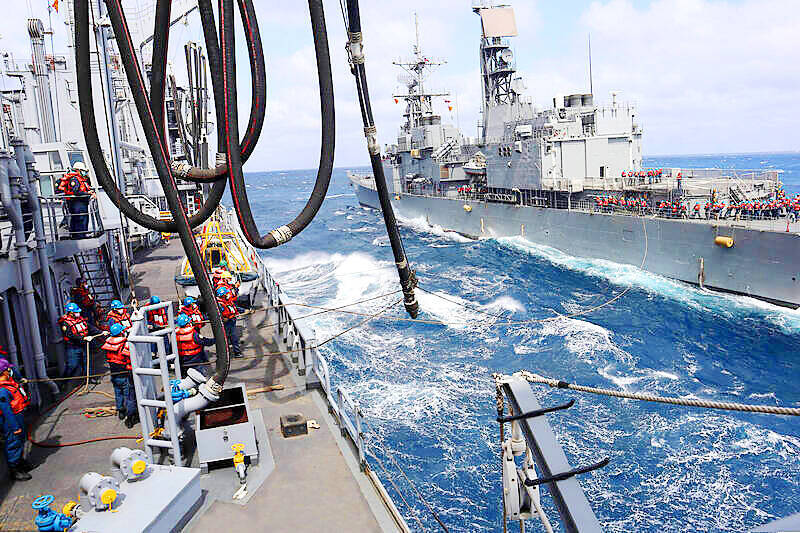 The crew of a fast-combat support ship, left, and a Keelung-class guided missile destroyer, right, conduct replenishment operations in an undated photograph taken during last year’s Ching Shih naval exercises.
Photo courtesy of the Navy Command
The crew of a fast-combat support ship, left, and a Keelung-class guided missile destroyer, right, conduct replenishment operations in an undated photograph taken during last year’s Ching Shih naval exercises.
Photo courtesy of the Navy Command