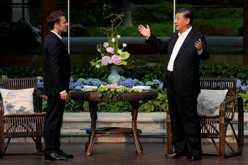 习近平和马克宏去年4月在中国广州相见欢。（路透档案照）(photo:LTN)