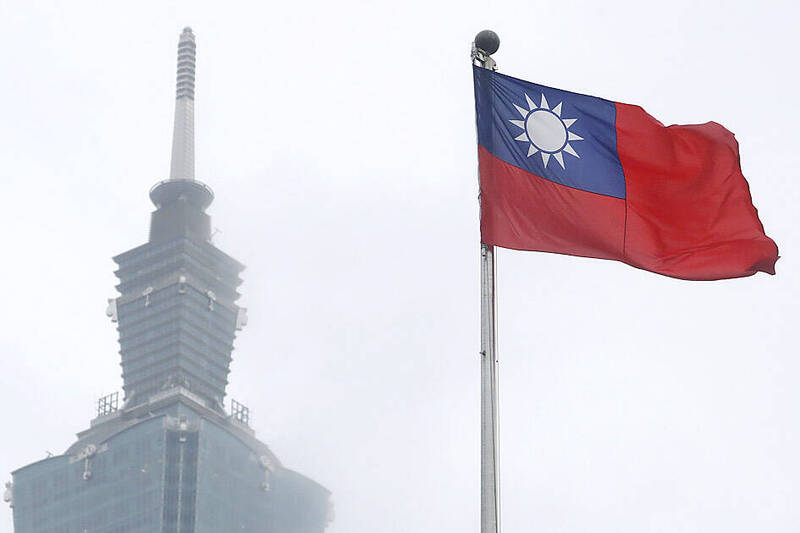 A national flag flutters near Taipei 101 in Taipei on May 7 last year.
Photo: Chiang Ying-ying, AP
A national flag flutters near Taipei 101 in Taipei on May 7 last year.
Photo: Chiang Ying-ying, AP