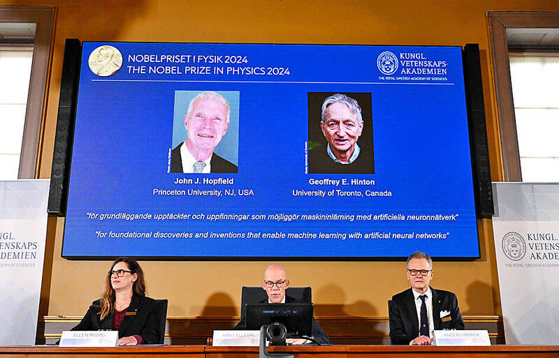 A screen shows the laureates of this year’s Nobel Prize in Physics, US physicist John Hopfield, left, and Canadian-British computer scientist and cognitive psychologist Geoffrey Hinton, during the announcement at the Royal Swedish Academy of Sciences in Stockholm yesterday.
Photo: AFP