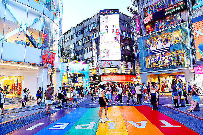 
A woman poses for photos in Taipei’s Ximending shopping district in an undated photograph.
Photo: Ann Wang, Reuters