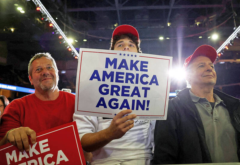 Supporters hold “Make America great again” placards at a campaign event for then-US presidential candidate Donald Trump in Allentown, Pennsylvania, on Tuesday last week.
Photo: Reuters