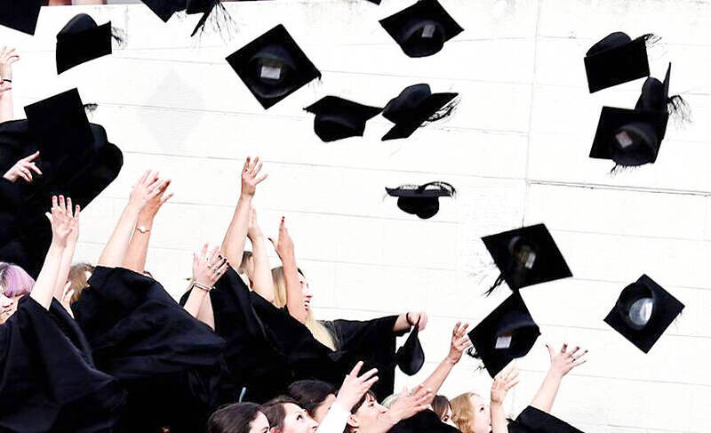 Graduates toss their caps in an undated photograph.
Photo: Reuters