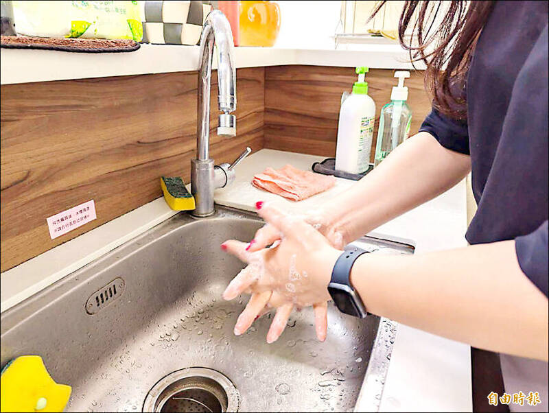 
A woman washes her hands in an undated photograph. 
Photo: Taipei Times