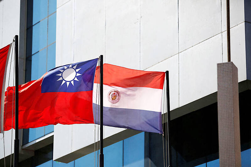 
The national flags of Paraguay and Taiwan are pictured outside the building housing Taiwan’s embassy in Asuncion, Paraguay, on April 19 last year. 
Photo: REUTERS