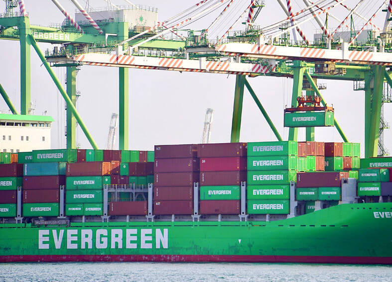 
Cranes, containers and an Evergreen cargo ship are pictured at the Port of Kaohsiung on March 30.
Photo: CNA