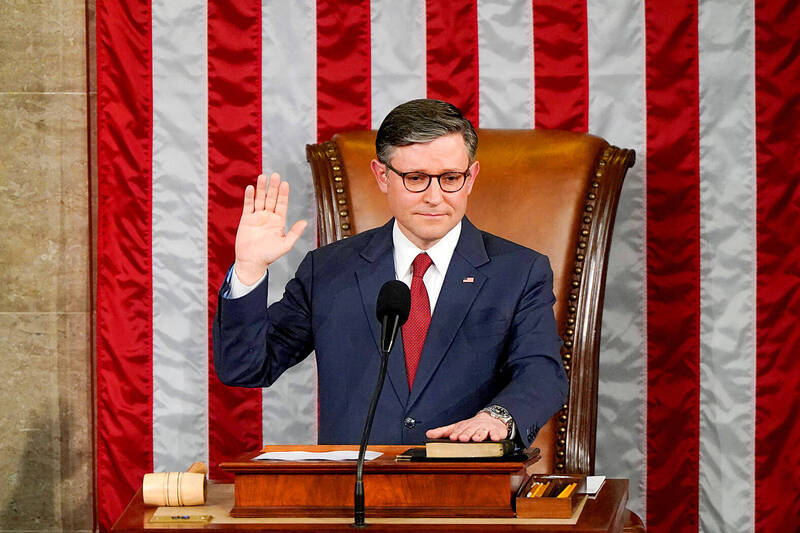 
US Representative Mike Johnson is sworn in as speaker of the House of Representatives after being re-elected at the US Capitol in Washington on Friday.
Photo: Reuters