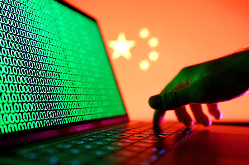 
A person types on a laptop with binary numbers displayed in front of the Chinese flag on Aug. 19, 2022.
Photo: Reuters