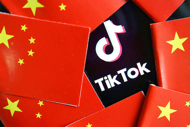 
China’s flags are seen near a TikTok logo in this illustration picture taken July 16, 2020. 
Photo: Reuters