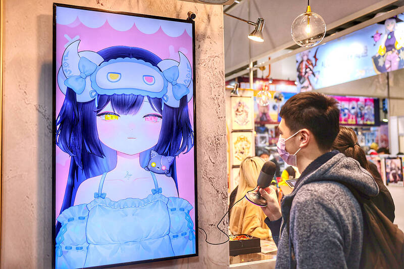 A person is pictured with an interactive installation at the Taipei International Comics and Animation Festival in Taipei yesterday.
Photo: CNA A person is pictured with an interactive installation at the Taipei International Comics and Animation Festival in Taipei yesterday.
Photo: CNA