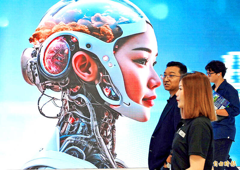 People walk past a poster advertising artificial intelligence at Computex Taipei at the Taipei Nangang Exhibition Center on June 4 last year.
Photo: Chang Chia-ming, Taipei Times