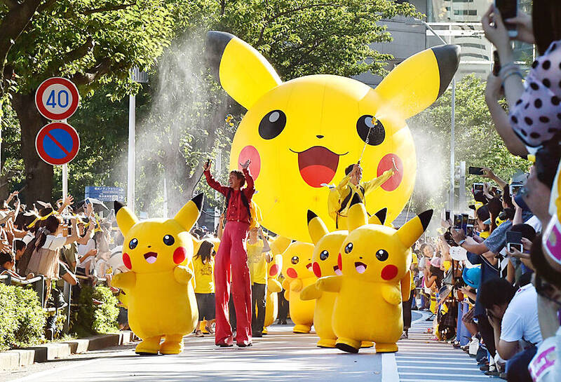
Performers dressed as Pikachu, the popular Pokemon animation series character, perform in a Pikachu parade in Yokohama, Japan, on Aug. 7, 2016. 
Photo: AFP