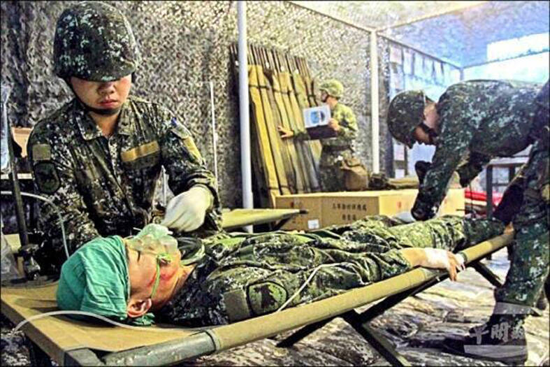 An undated photo shows army medics treating a “casualty” in a simulation exercise.
Photo courtesy of the 8th Army Corps
An undated photo shows army medics treating a “casualty” in a simulation exercise.
Photo courtesy of the 8th Army Corps