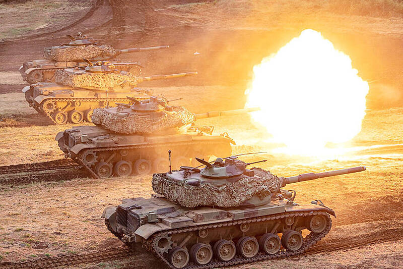 A Taiwanese US-made M60A3 tank fires its main gun during the annual Han Kuang military exercises on Taiwan’s Penghu Islands in this handout photo taken on July 24 last year.
Photo: AFP photo, Taiwan’s Ministry of National Defense
A Taiwanese US-made M60A3 tank fires its main gun during the annual Han Kuang military exercises on Taiwan’s Penghu Islands in this handout photo taken on July 24 last year.
Photo: AFP photo, Taiwan’s Ministry of National Defense
