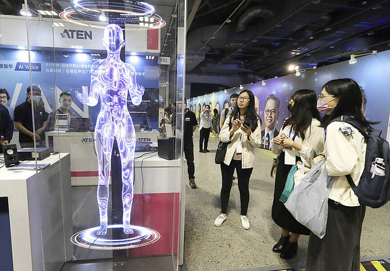 People visit the AI EXPO Taiwan exhibition in Taipei yesterday.
Photo: Chiang Ying-ying, AP
People visit the AI EXPO Taiwan exhibition in Taipei yesterday.
Photo: Chiang Ying-ying, AP