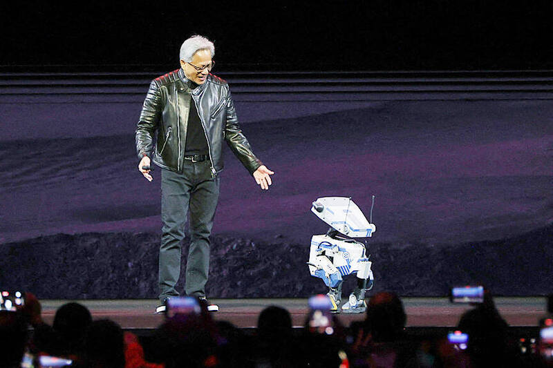 Nvidia Corp chief executive officer Jensen Huang interacts with a small robot on stage at the Nvidia GPU Technology Conference at the SAP Center in San Jose, California, on March 18.
Photo: Reuters Nvidia Corp chief executive officer Jensen Huang interacts with a small robot on stage at the Nvidia GPU Technology Conference at the SAP Center in San Jose, California, on March 18.
Photo: Reuters