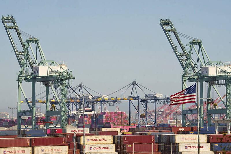 Yang Ming Marine Transport Corp containers are stacked up at the Port of Los Angeles on April 9.
Photo: AP Yang Ming Marine Transport Corp containers are stacked up at the Port of Los Angeles on April 9.
Photo: AP