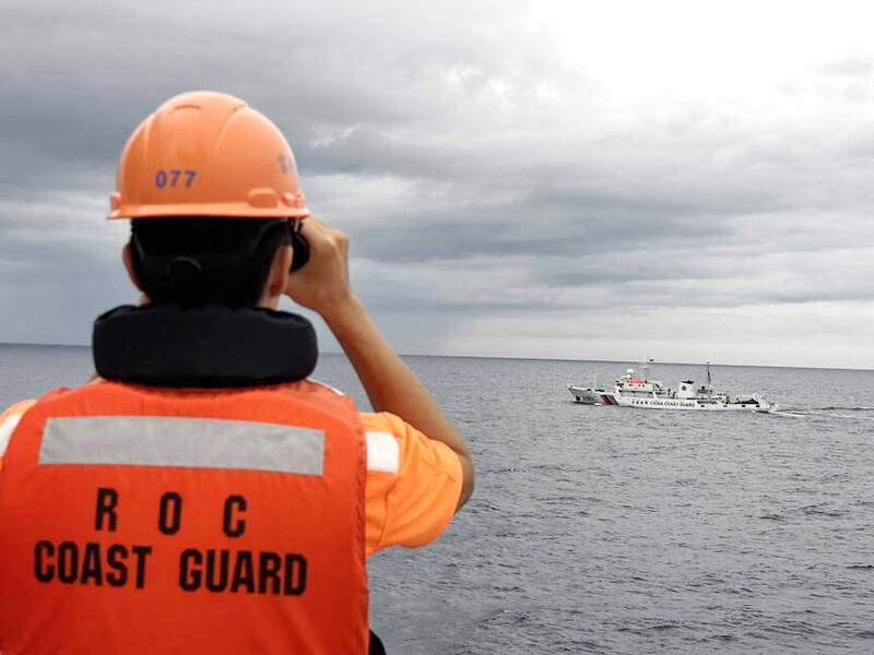 A coast guard officer keeps watch over a Chinese vessel in an undated photograph.
Photo courtesy of the Coast Guard Administration A coast guard officer keeps watch over a Chinese vessel in an undated photograph.
Photo courtesy of the Coast Guard Administration
