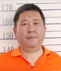 通缉中的郭再添。（撷取自法务部调查局网站）
